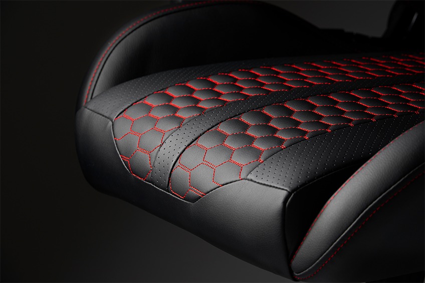 The seat of a black gaming chair