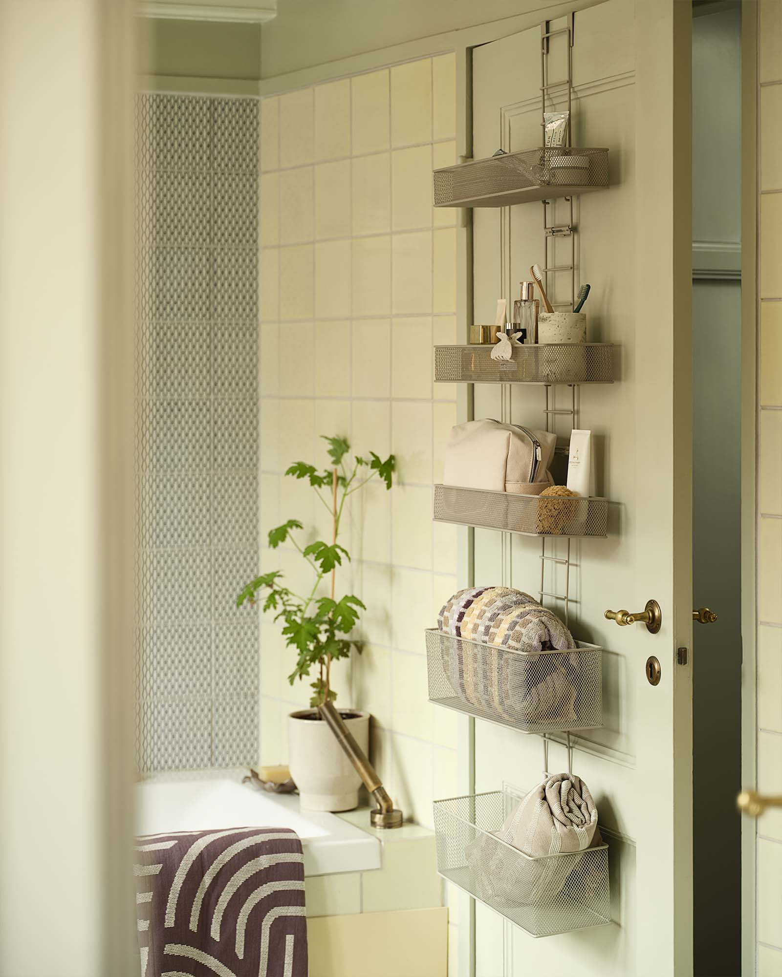 HULT bathroom hanging storage Small bathroom storage with several shelves hanging over a door