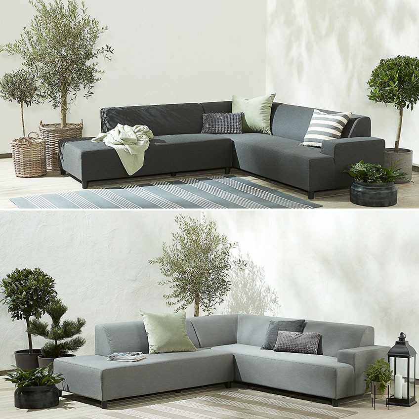 Dark and light grey garden sofa on in a corner on a patio