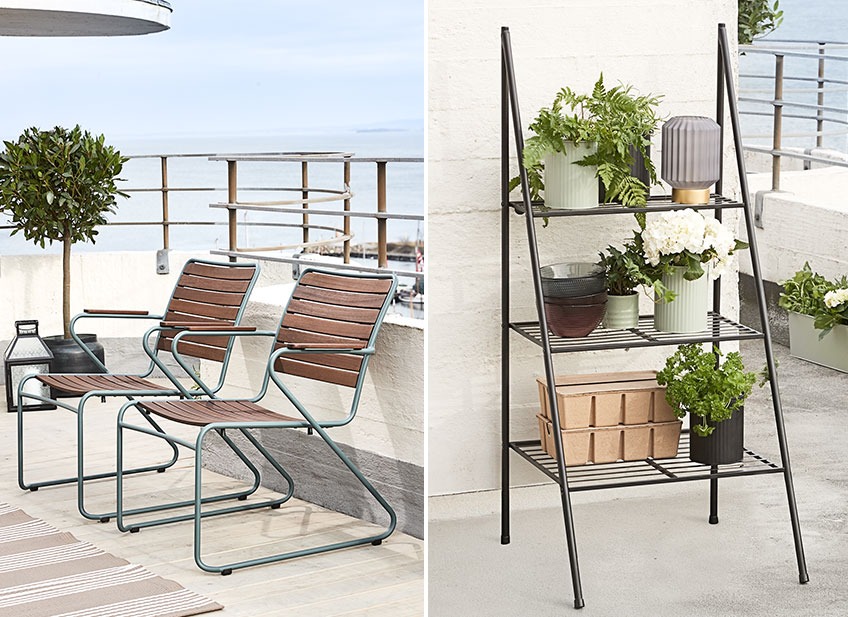 Two lounge chairs on a balcony and a plant ladder with planters, boxes and vases