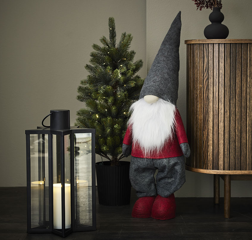 Black lantern, artificial Christmas tree and Christmas elf
